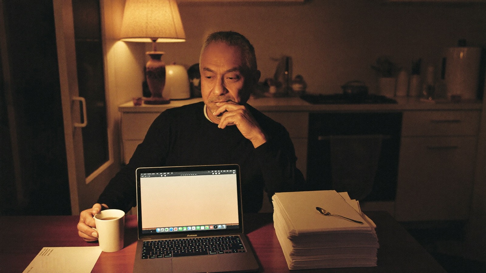 Working through paperwork calmly at a kitchen table