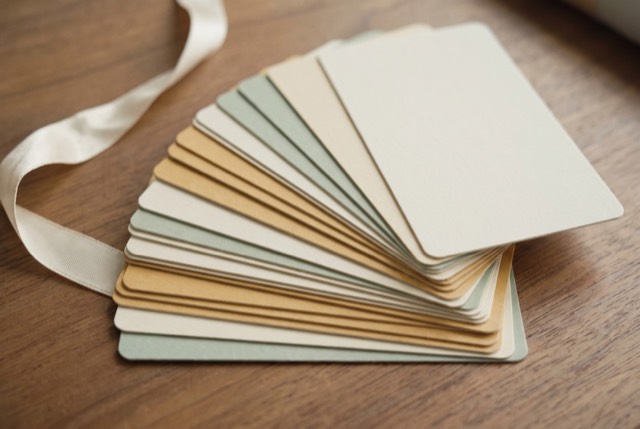 A fan of blank gift cards on a table